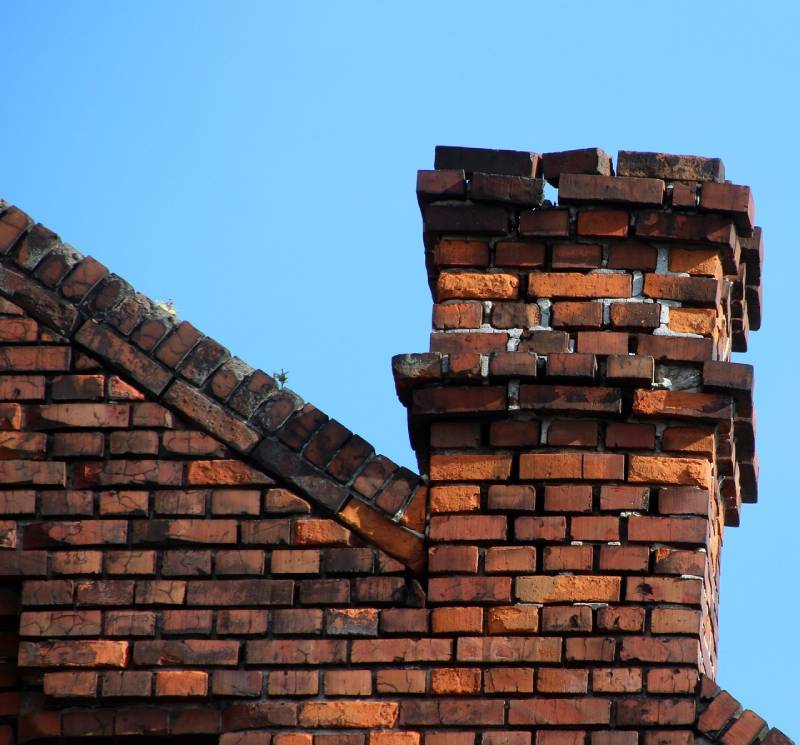 Blog Article - Damaged chimney on an Santee home showing cracks and missing mortar